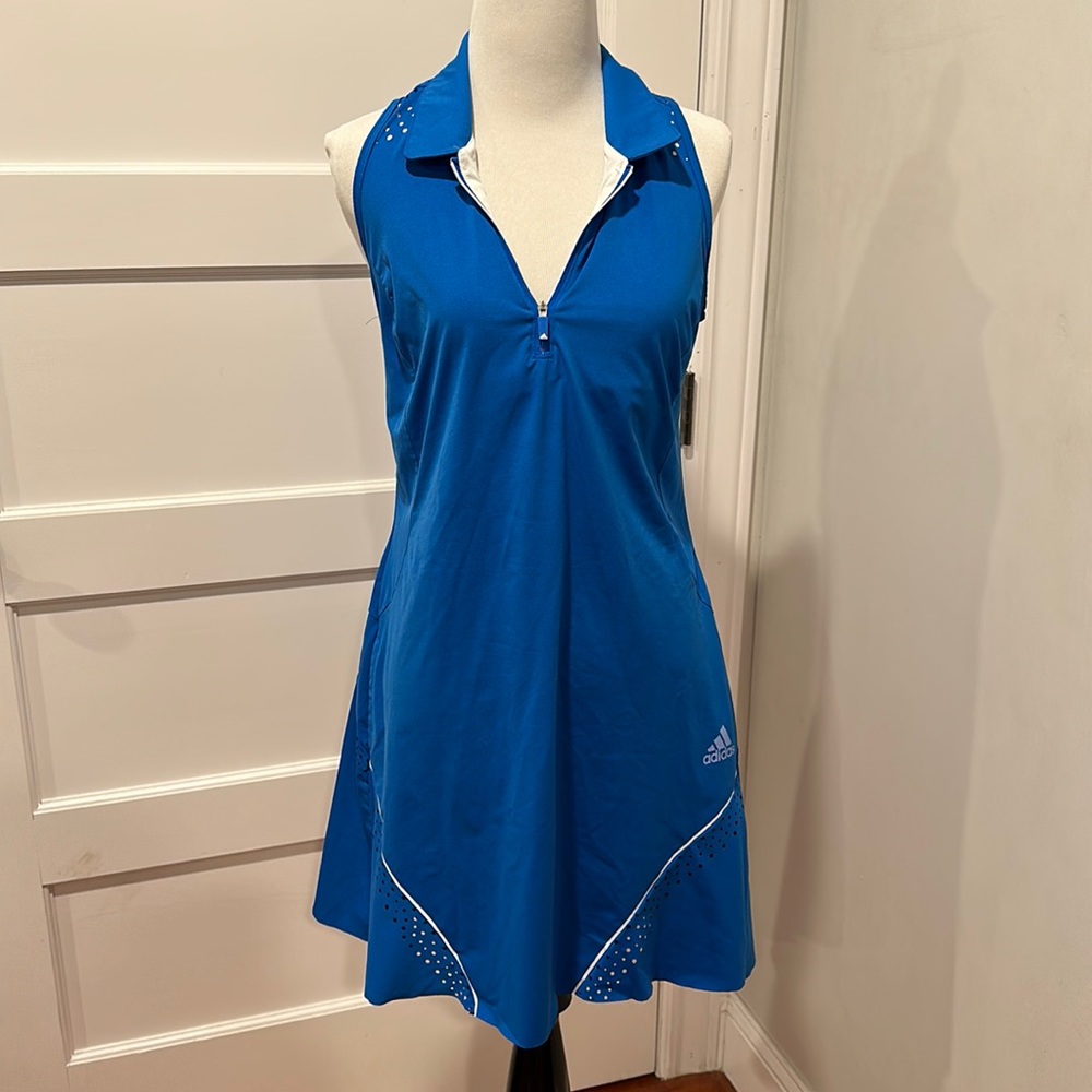 Tennis dress with bar included. Comes with shorts